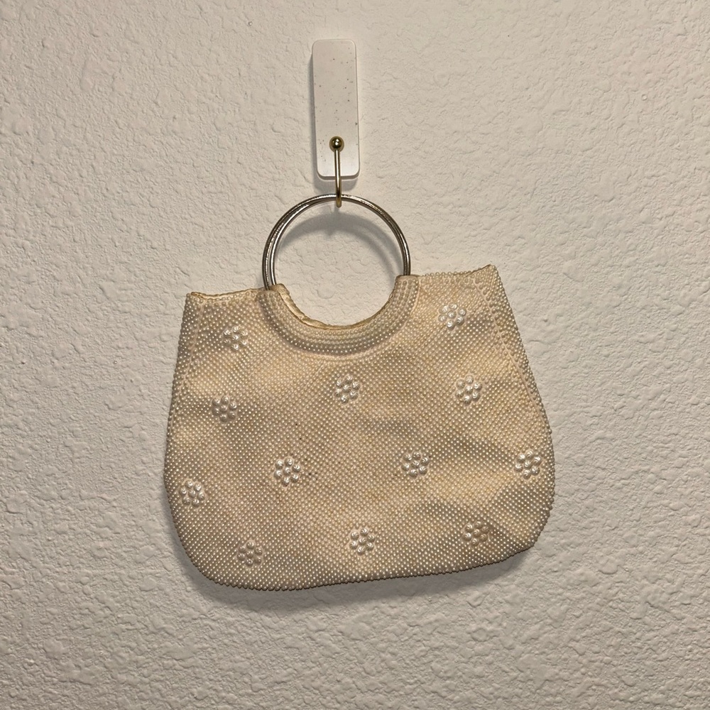 Elegant Cream Handbag with Floral Accents